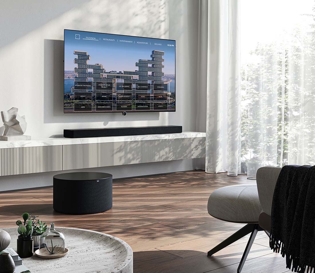 An in-room hotel TV showing the Atlantis The Royal interface