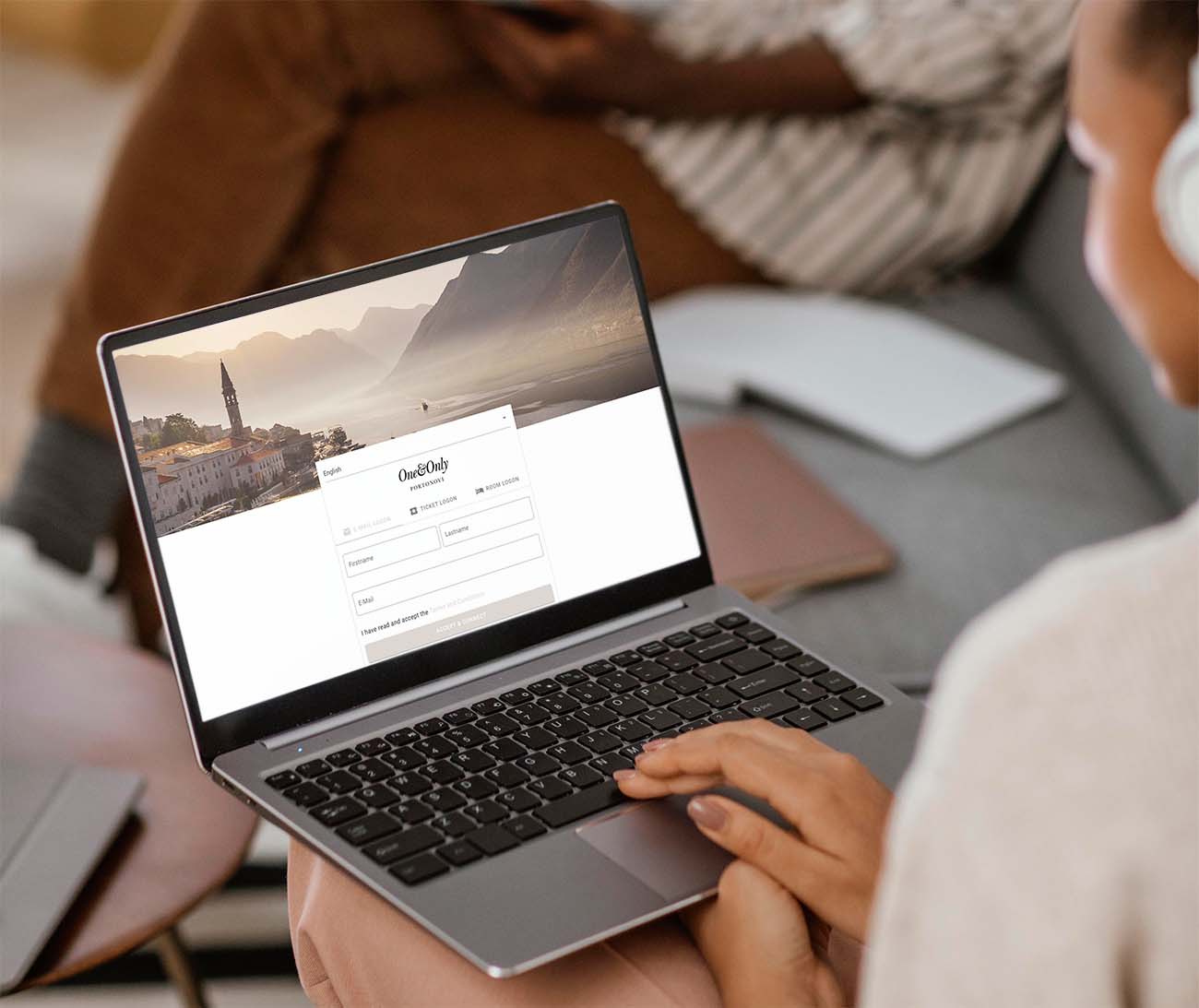A guest connecting to the hotel WiFi captive-portal login page on a laptop