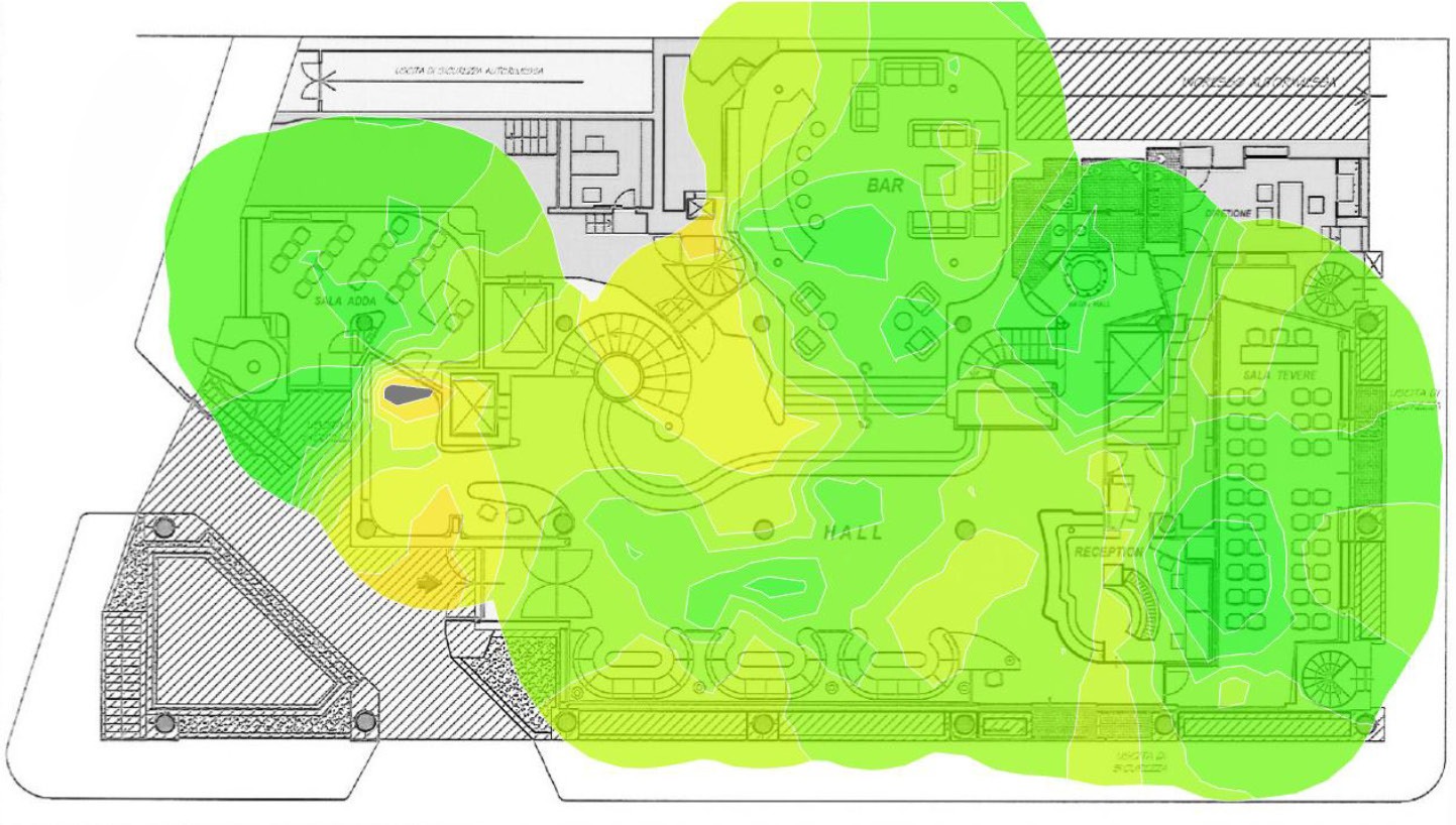 A WiFi coverage heat-map overlaid on a hotel floor plan, showing signal strength across the lobby, bar and meeting rooms