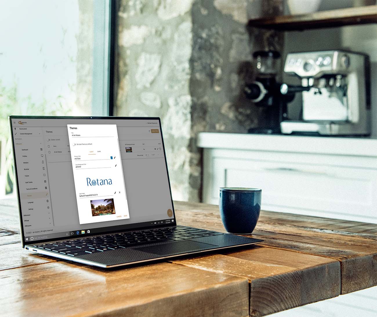 A laptop showing the at-visions management dashboard used to design and monitor the property network